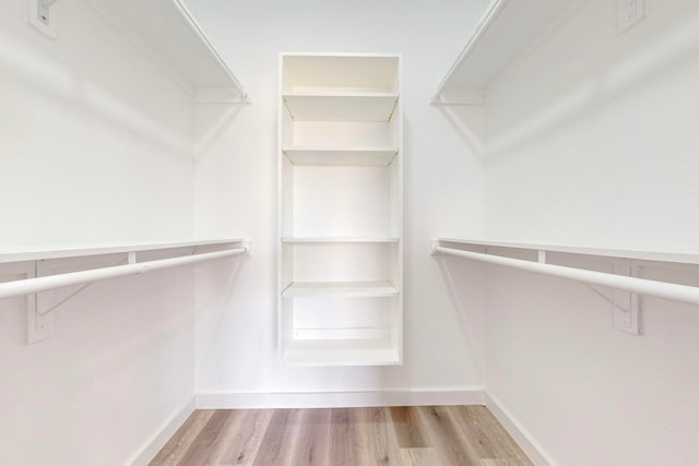 spacious closet with light wood-type flooring