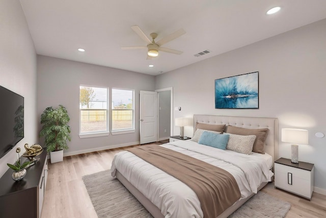 bedroom featuring light wood-type flooring and ceiling fan