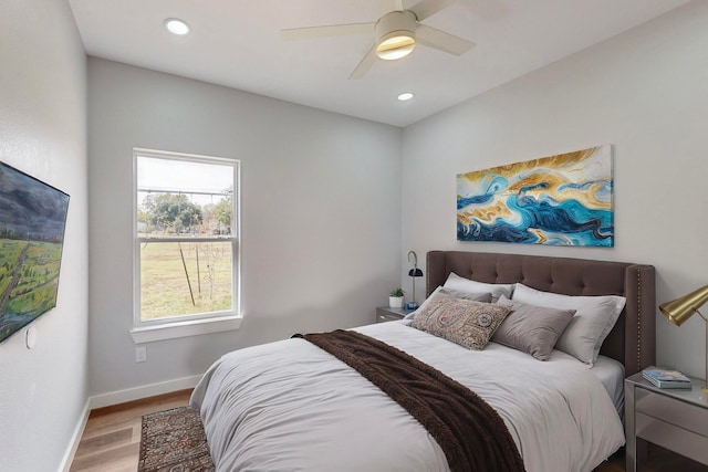 bedroom featuring hardwood / wood-style flooring and ceiling fan