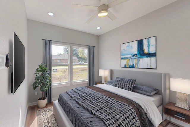 bedroom with ceiling fan and wood-type flooring