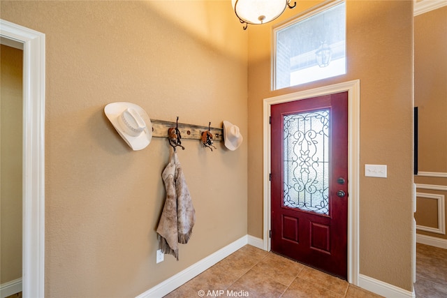 foyer featuring light tile patterned floors