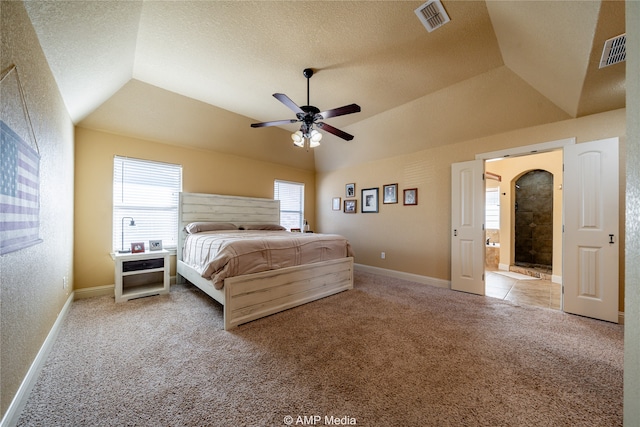 unfurnished bedroom featuring carpet, ceiling fan, a textured ceiling, and lofted ceiling