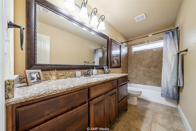 full bathroom featuring shower / bath combination with curtain, a textured ceiling, toilet, vanity, and tile patterned floors