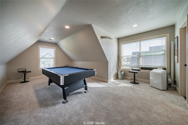 game room with light carpet, a textured ceiling, billiards, and plenty of natural light