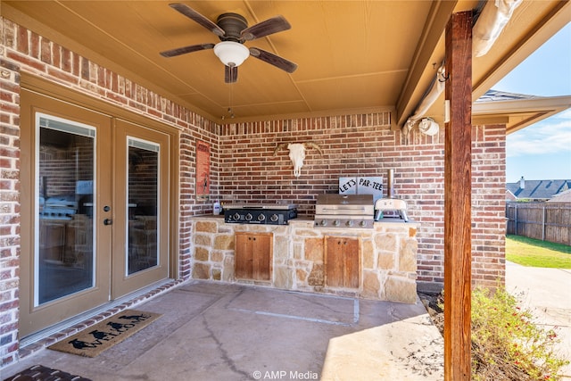 view of patio / terrace with french doors, grilling area, an outdoor kitchen, and ceiling fan