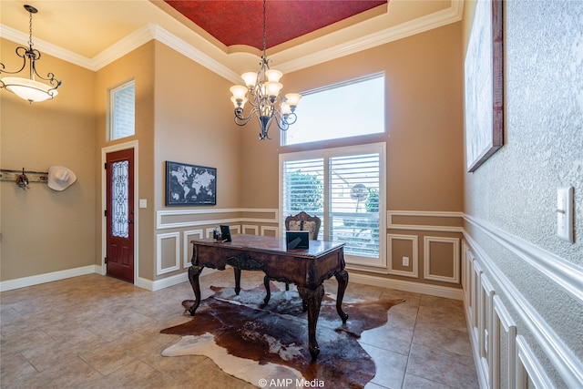 office space with ornamental molding and a chandelier