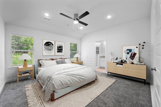 bedroom with connected bathroom, carpet flooring, lofted ceiling, and ceiling fan