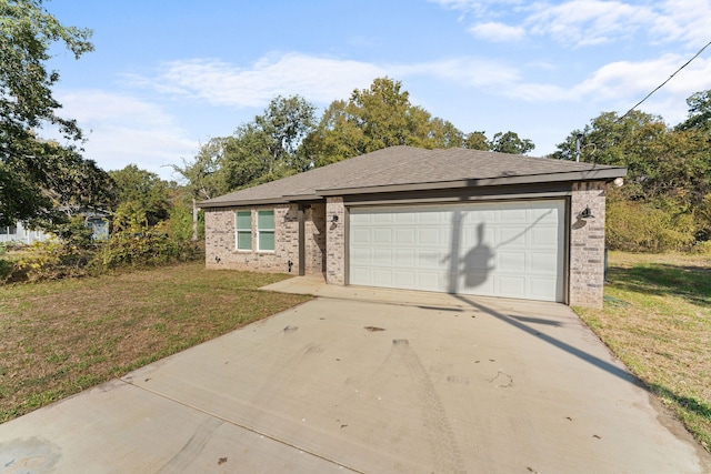 single story home with a front lawn and a garage