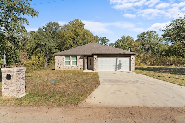 view of front facade with a garage and a front lawn