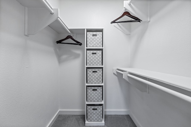 spacious closet with tile patterned floors