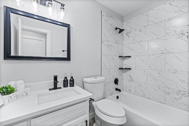 full bathroom with vanity, toilet, and tiled shower / bath