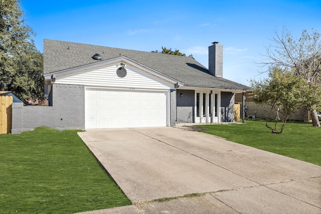 ranch-style home featuring a front yard and a garage