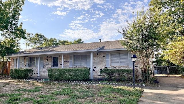 single story home with covered porch