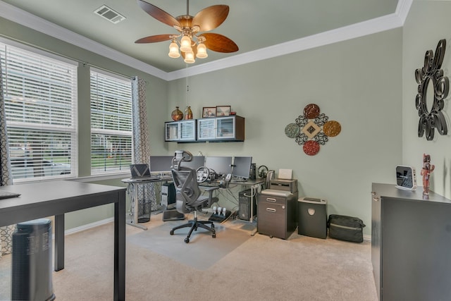 carpeted office with ornamental molding and ceiling fan