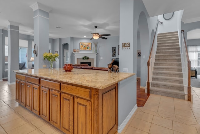 kitchen with light stone countertops and light tile patterned floors