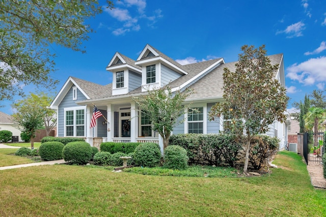 view of front of property with a porch and a front yard