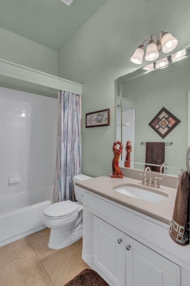 full bathroom with toilet, vanity, tile patterned floors, and shower / tub combo