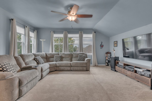 carpeted living room featuring lofted ceiling, ceiling fan, and a wealth of natural light