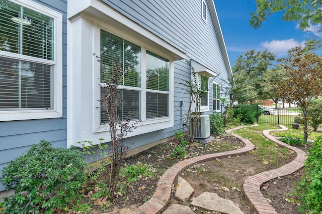 view of side of property featuring central AC unit