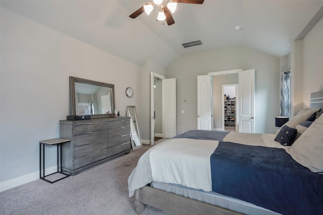 carpeted bedroom featuring lofted ceiling and ceiling fan