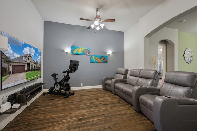 living room with dark wood-type flooring and ceiling fan