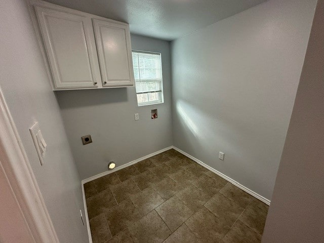 laundry room featuring cabinets, hookup for an electric dryer, and hookup for a washing machine