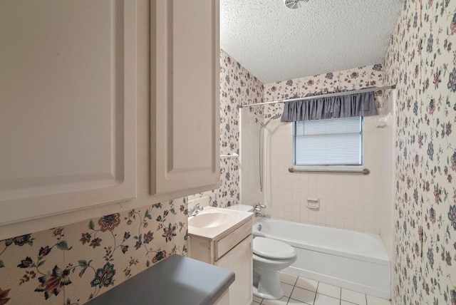 full bathroom featuring tiled shower / bath, a textured ceiling, toilet, vanity, and tile patterned flooring