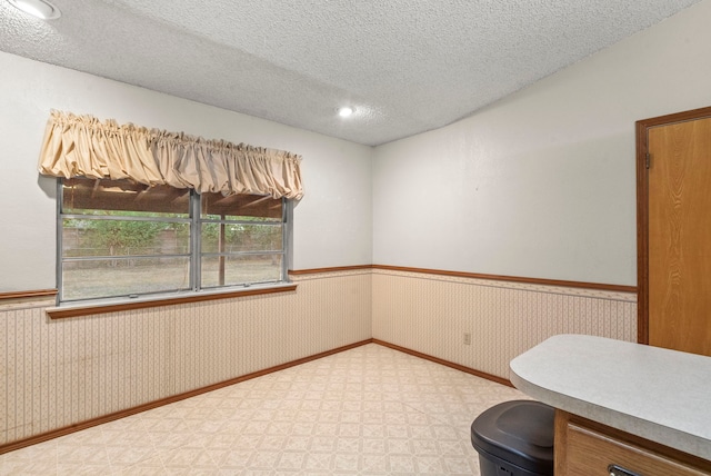 interior space with a textured ceiling