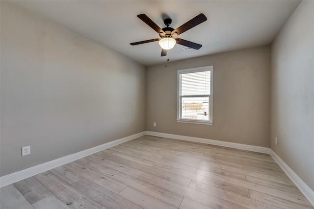 empty room with light hardwood / wood-style flooring and ceiling fan