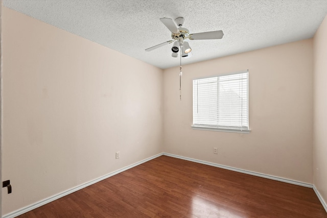 spare room featuring hardwood / wood-style floors, a textured ceiling, and ceiling fan