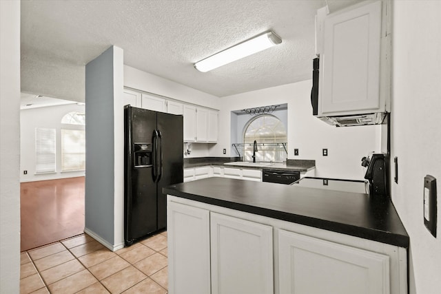 kitchen with black appliances, light tile patterned flooring, sink, a textured ceiling, and white cabinetry