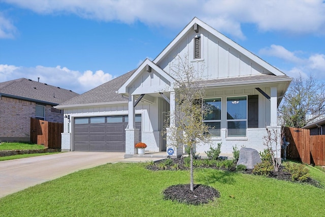 view of front of property with a garage and a front yard