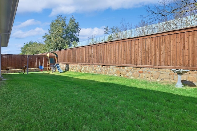 view of yard with a playground