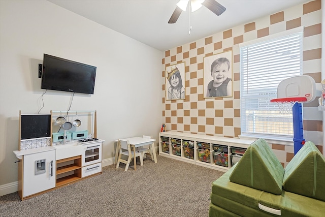 game room with carpet and ceiling fan