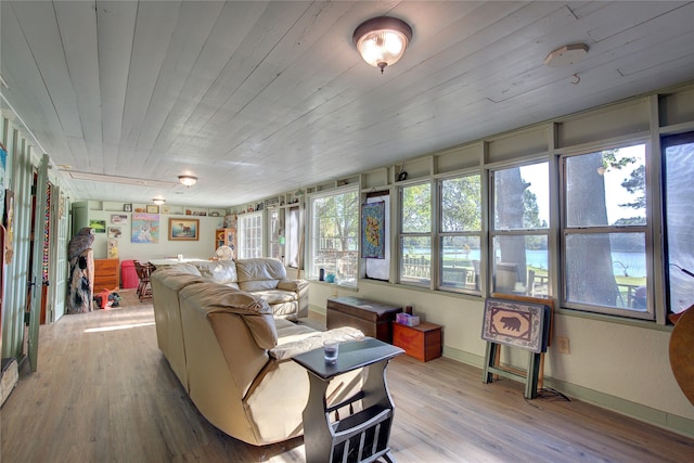 sunroom / solarium with a wealth of natural light and wooden ceiling