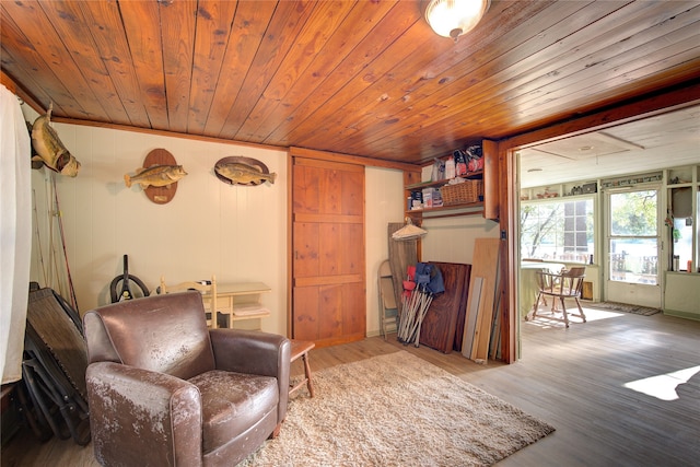 sitting room featuring wood ceiling and hardwood / wood-style flooring