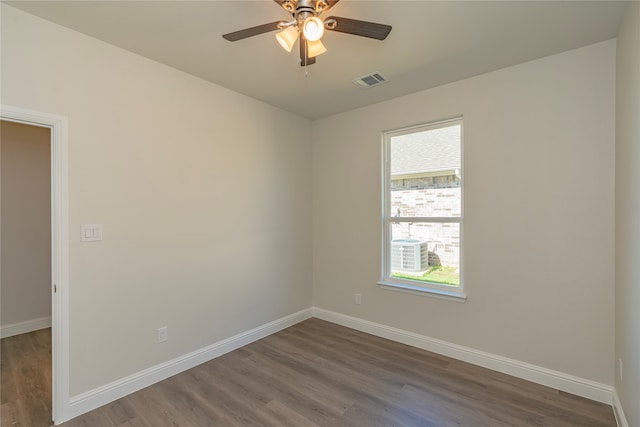 spare room featuring ceiling fan and dark hardwood / wood-style floors