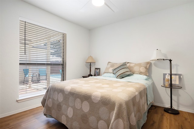 bedroom with ceiling fan and wood-type flooring