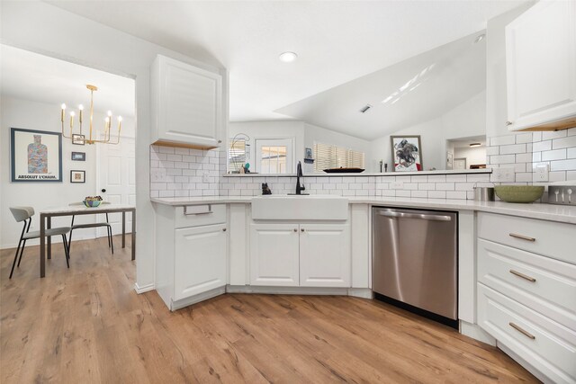 kitchen with stainless steel dishwasher, light hardwood / wood-style floors, white cabinetry, and sink