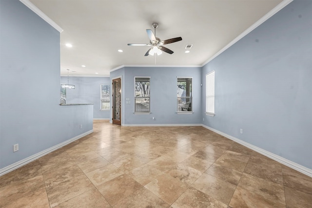 spare room featuring ceiling fan and crown molding