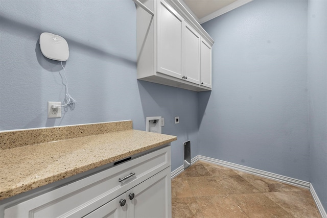 laundry room featuring washer hookup, electric dryer hookup, and cabinets