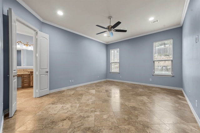 unfurnished room featuring ceiling fan and ornamental molding