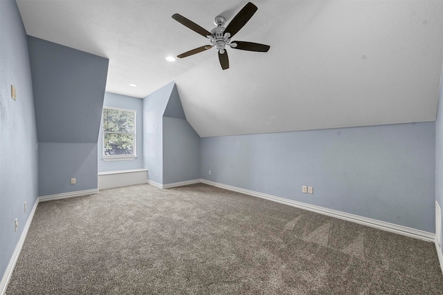 additional living space featuring carpet flooring, ceiling fan, and lofted ceiling