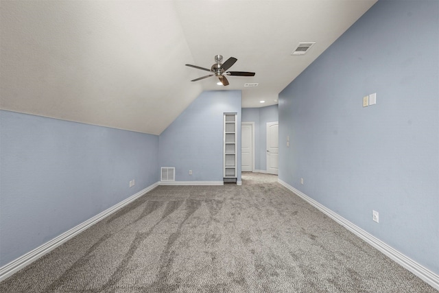 bonus room with ceiling fan, light colored carpet, and lofted ceiling