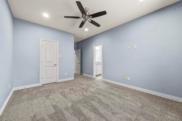 unfurnished bedroom with carpet, ceiling fan, and connected bathroom