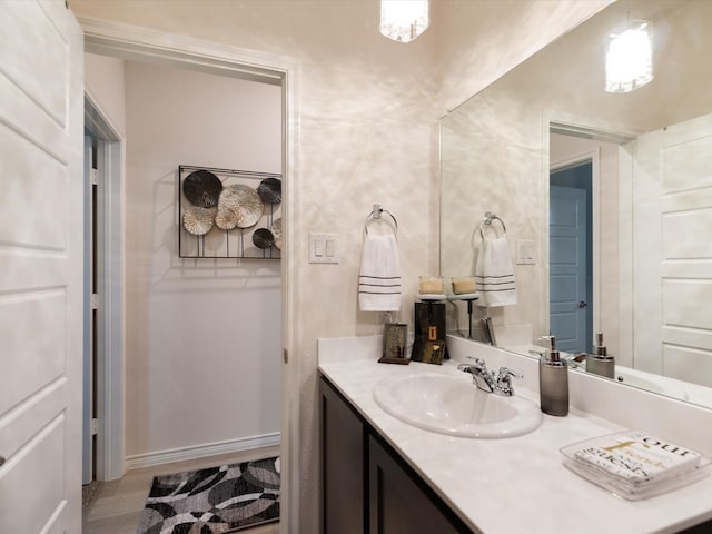 bathroom featuring vanity and hardwood / wood-style flooring