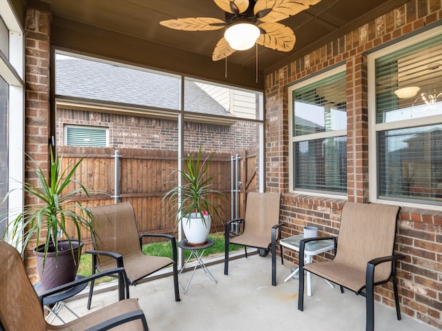 sunroom / solarium with ceiling fan