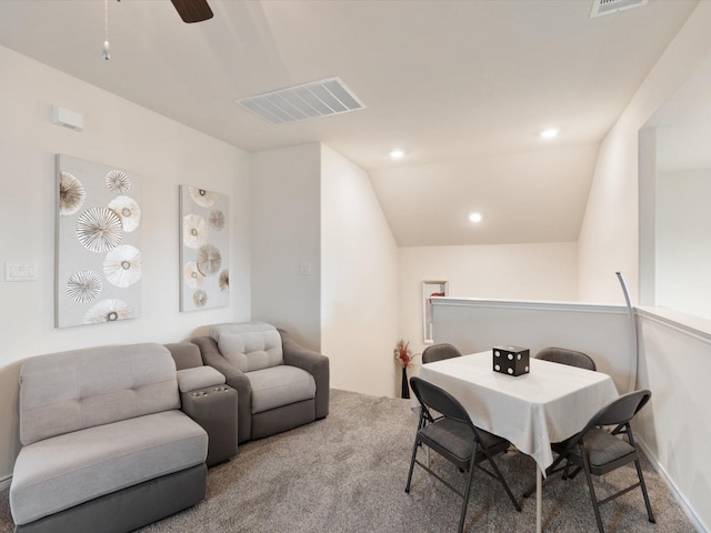 dining area featuring carpet floors, vaulted ceiling, and ceiling fan