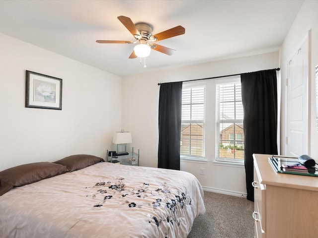 bedroom featuring light carpet and ceiling fan