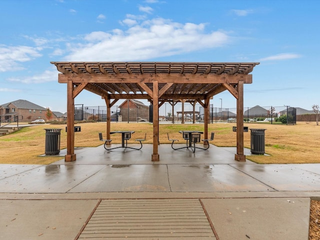 surrounding community with a pergola, a patio, and a yard